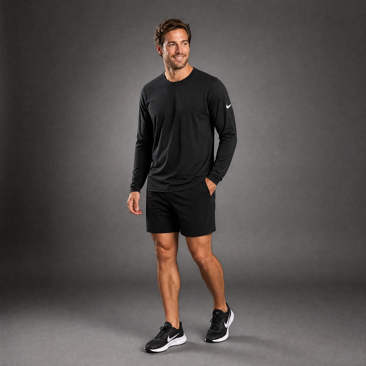 Male athlete modeling the black Nike Cotton Long Sleeve Men's Tee